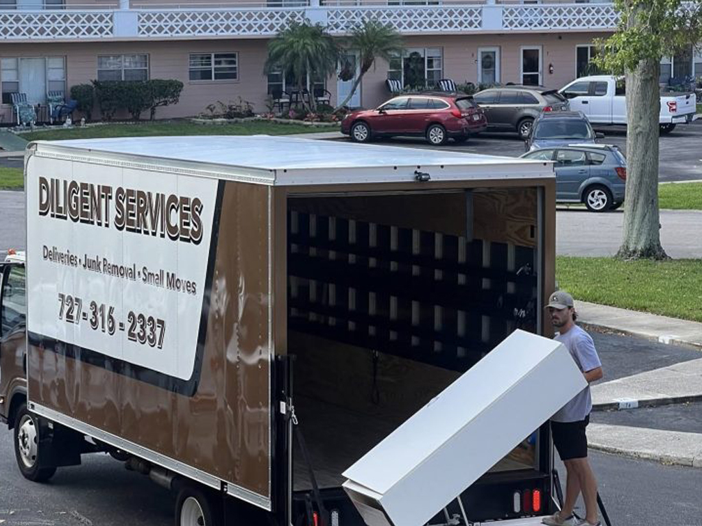 Diligent-Services-team-carefully-moving-furniture-into-Clearwater-apartment